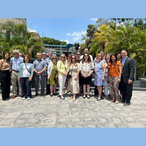 Group attendees standing before a landmark in Panama