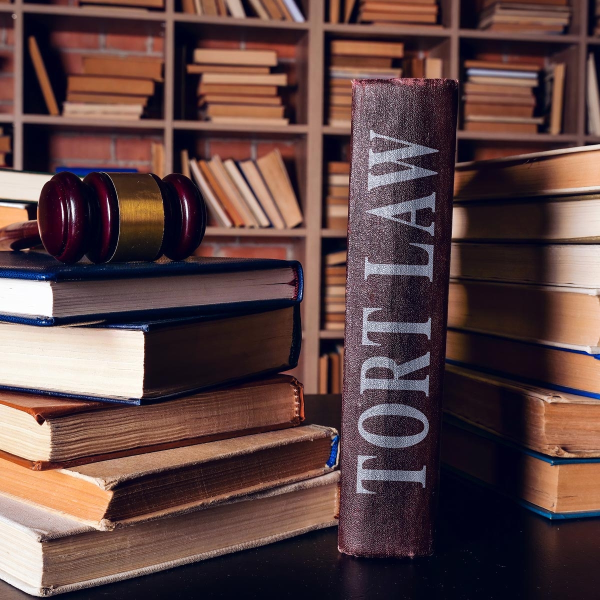 stack of law books readying Tort Law
